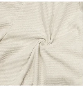 Detailed close-up of premium beige corduroy fabric texture for men's heavyweight cargo shorts