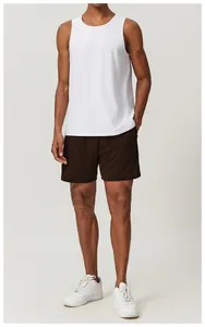 Close-up of men's chocolate brown quick-dry breathable mesh sports shorts on model