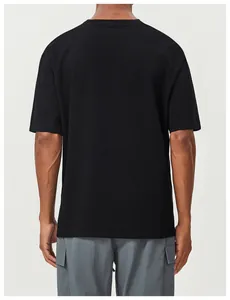 Back view of a black cotton men's sports t-shirt paired with gray cargo shorts
