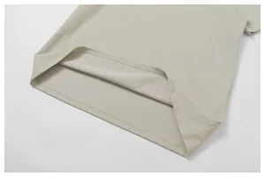 Detailed macro view showing the high-quality hem stitching of a breathable cotton Polo shirt.