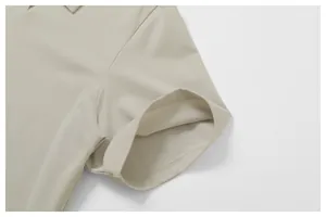 Close-up detail of the sleeve cuff and breathable mesh fabric on a khaki Polo shirt