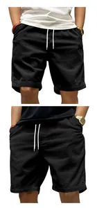 Detailed close-up view of men's black corduroy cargo shorts featuring white drawstring.