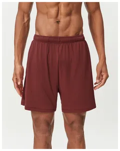 Detailed view of men's quick-dry breathable burgundy sports shorts with mesh texture design