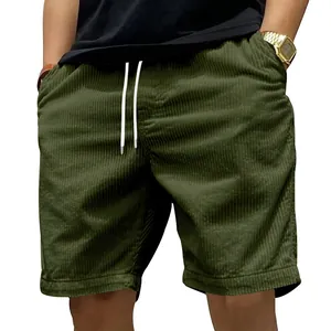 Detail showing texture of men's olive green corduroy shorts with white drawstring