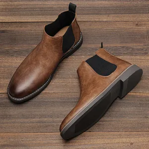Premium brown burnished leather Chelsea boots for men shown on rustic wood surface