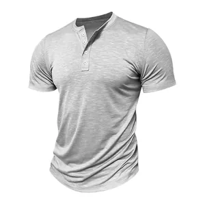 Macro view of grey slub fabric texture on a men's Henley short sleeve shirt