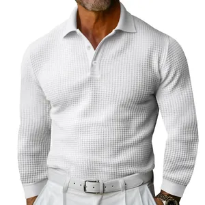 Macro view of white waffle knit texture on a men's long sleeve polo shirt with buttons