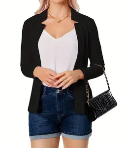 Detail showing women's black open-front blazer with notched collar and long sleeves