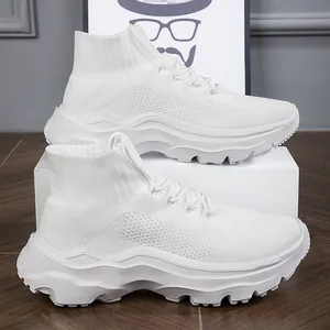 Side view of white high-top flyknit sneakers featuring thick wavy soles and breathable fabric.