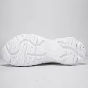 Detailed view of the chunky white anti-slip sole of the breathable sports shoes