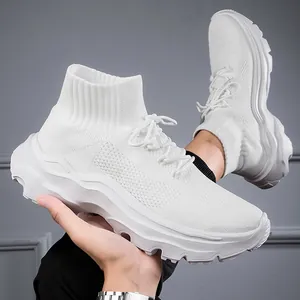 Close-up of white high-top flyknit sneakers featuring breathable mesh and thick wavy sole