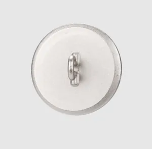 High-end detail view of the silver metal shank button back with a welded bottom loop.