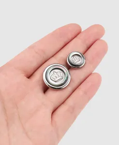 Close-up of premium thick copper buttons featuring a classic crown emblem design.