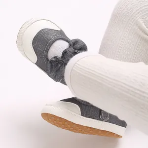 Close-up of baby girl pre-walker shoes with classic bowknot and soft non-slip sole
