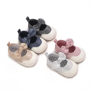 Detailed close-up view of baby girl walking shoes in five colors with decorative bow