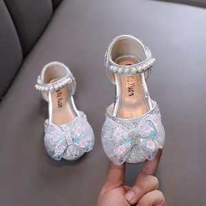 Shiny silver princess shoes for girls with glittery butterfly bow and pearl strap