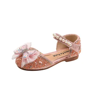 Elegant pink girls princess shoes featuring sparkling rhinestones and a mesh butterfly bow