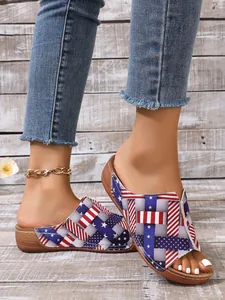 Detailed view of women's peep-toe wedge sandals with American flag woven pattern