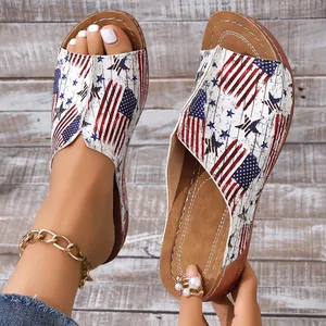 Detail of women's open-toe slide sandals with vintage American flag star and stripe print