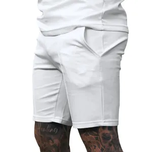 Side view of white ribbed golf shorts for men showing pocket detail and fabric texture