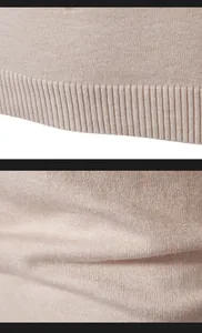 Detalle macro de un suéter de punto para hombre que muestra el dobladillo acanalado.
