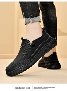 Close-up of black men's casual leather shoes with handmade stitching and thick sole