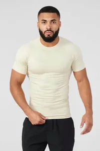Detailed front view of men's muscle fit compression T-shirt in cream for gym training.