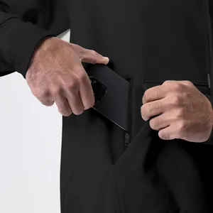 Close-up of black men's fleece hoodie showing the functional zippered chest pocket