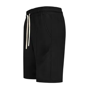 Side view of men's black ribbed casual golf shorts featuring white drawstring detail.