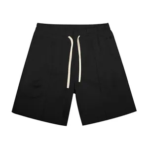 Detailed view of men's black golf shorts featuring a cream drawstring and pockets.