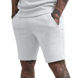 Detailed rear view of white men's sports shorts showing the athletic fit and seams.