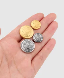 Detailed view of high-end vintage metal buttons with intricate crest design