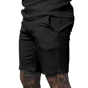 Macro view showing the fabric texture and pocket detail of men's black athletic shorts