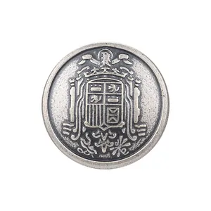 Vintage antique silver metal button with detailed heraldic crest engraving for coats