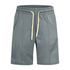 Detailed macro view of men's grey ribbed leisure golf shorts with white drawstring