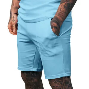 Close-up of light blue men's athletic shorts featuring side pockets and a clean fit.