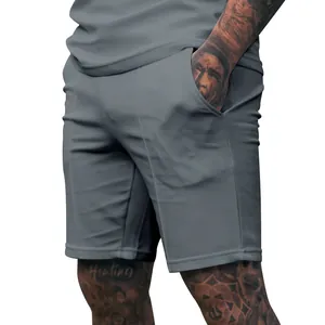 Detail view of men's gray sports shorts featuring side pockets and a clean fit.