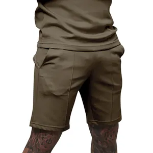 Detailed view of men's olive golf shorts featuring vertical ribbed texture and fit.
