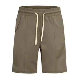 Front view of brown men's golf leisure shorts with drawstring waist and seam detail
