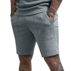 Detailed view of men's gray athletic shorts with side pockets and vertical texture.