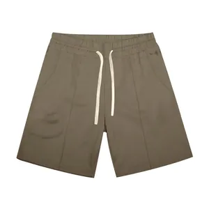 Detailed view of men's olive green rib knit golf shorts featuring white drawstring