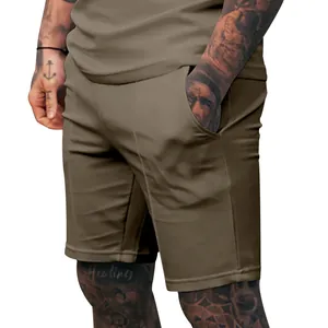 Detail view of men's solid khaki shorts for summer fitness and casual wear