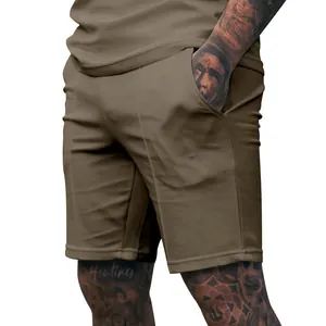 Detail shot of men's brown fitness shorts with side pocket and soft fabric texture