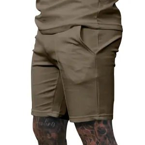 Close-up detail of men's olive green summer casual fitness sports shorts with pockets