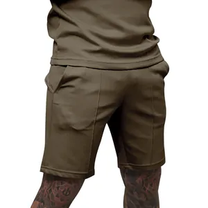 Detail of men's olive green casual fitness shorts with decorative athletic seams