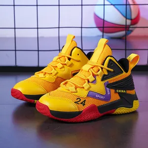 Side view of vibrant yellow breathable mesh kids basketball shoes with red non-slip sole