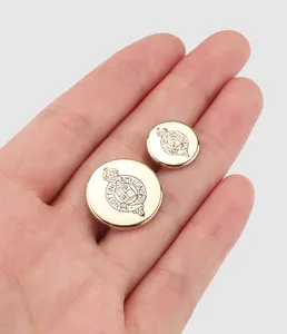 Close-up detail of high-quality vintage gold metal buttons with intricate crest engraving