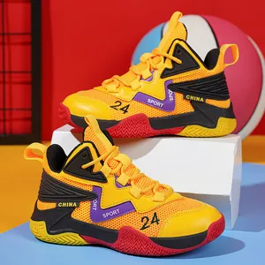 Detailed view of yellow youth basketball shoes featuring breathable mesh and non-slip soles