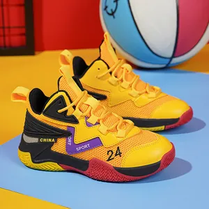 Macro view of breathable mesh children's basketball shoes in bright yellow and orange colors