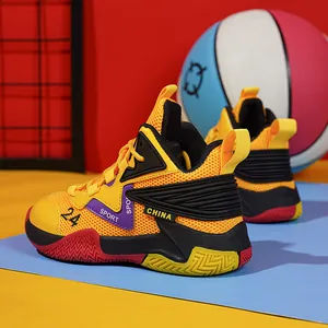 Detail view of yellow breathable mesh basketball shoes for kids with sport accents